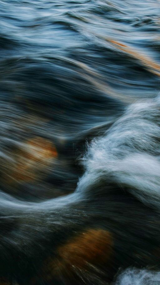 A waterfall falling through mist